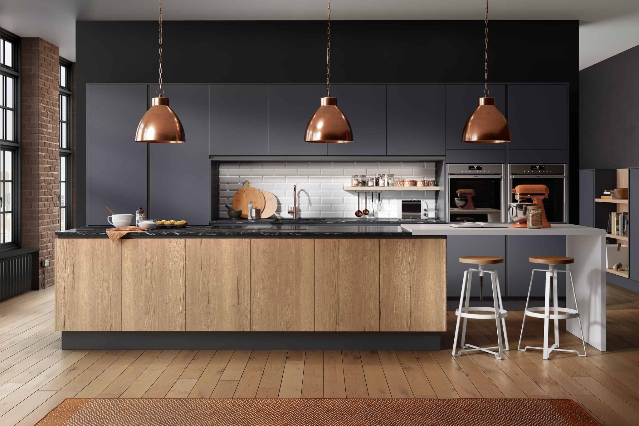 Modern kitchen with dark cabinetry and copper pendants